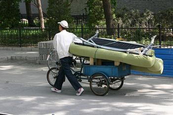 Carrying your sofa home on a bicycle.