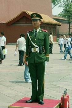 Soldiers standing at attention in front of Tian'an Men give it an 
aura of reverence